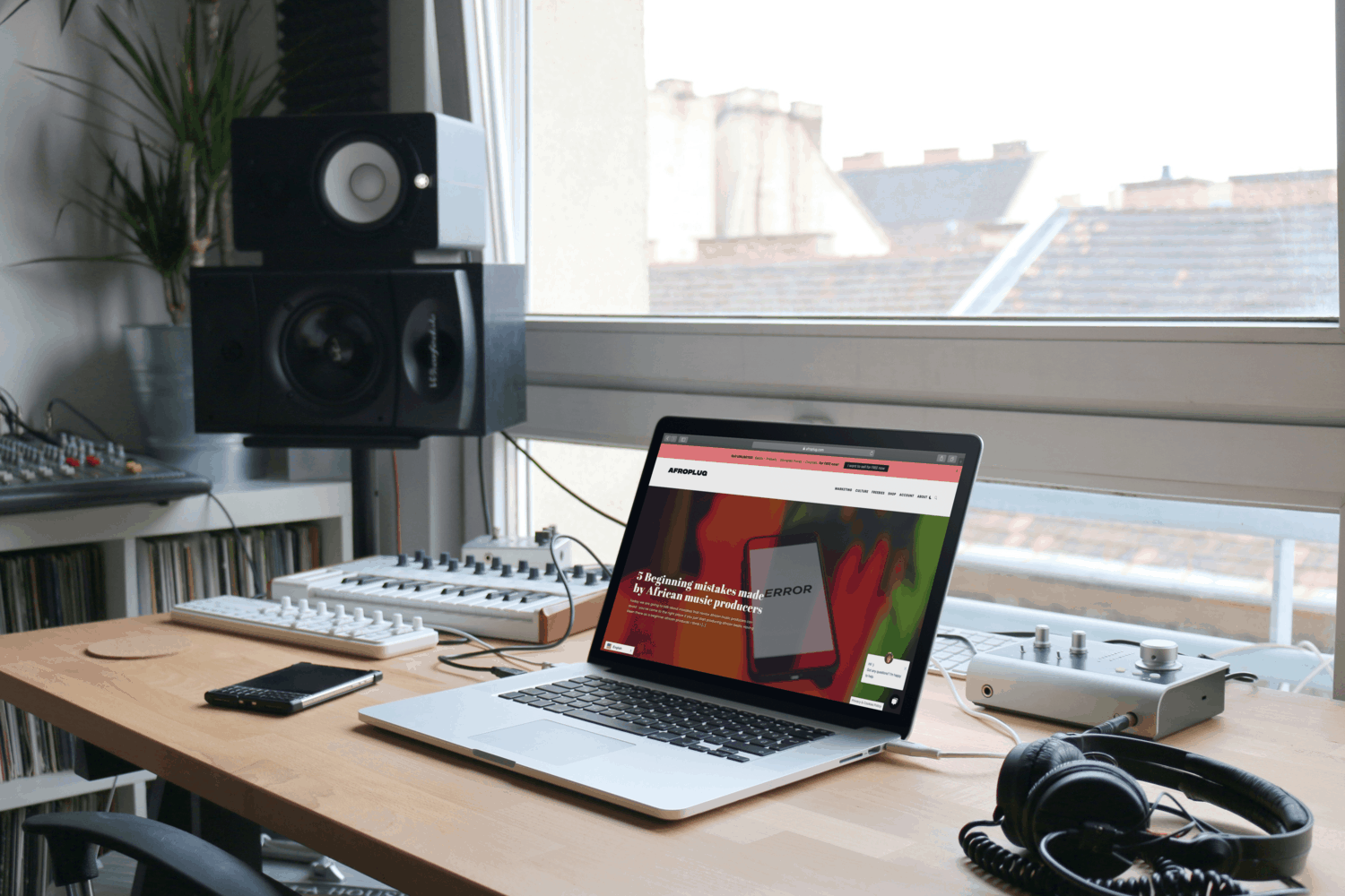 Home studio with a mackbook pro watching Aforplug's website